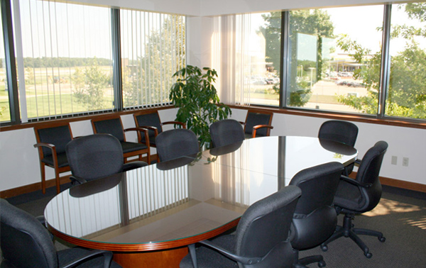 Real Estate Boat Shape Conference Table and Furnishings by Office One - Kalamazoo Michigan